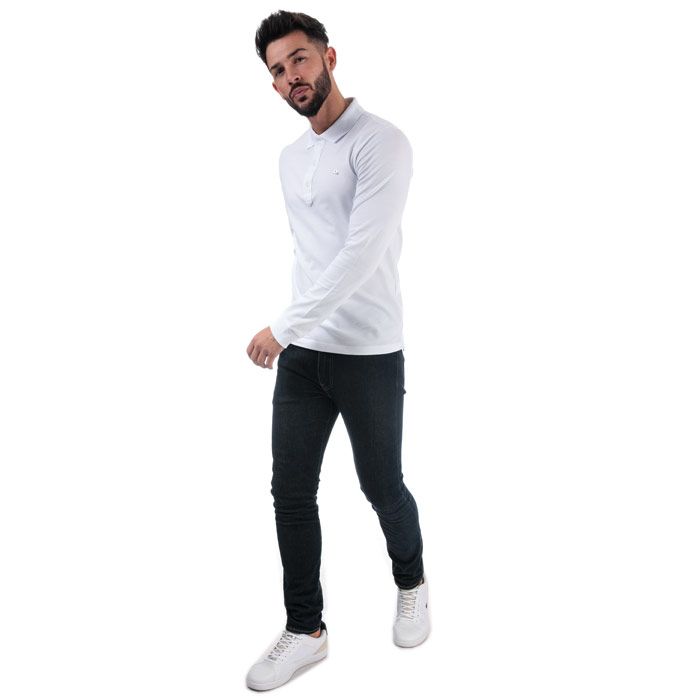 Mens Diesel T-Kalar Long A Rags Polo in White. – Long sleeve. – Ribbed cuffs and collar. – Side split droptail hem. – 4 button placket. – Branding to chest. – Shoulder to hem 27in approximately – 97% Cotton  3% Elastane. Machine Washable – Ref: 00STY42RMXZ100 – Measurements are intended for guidance only