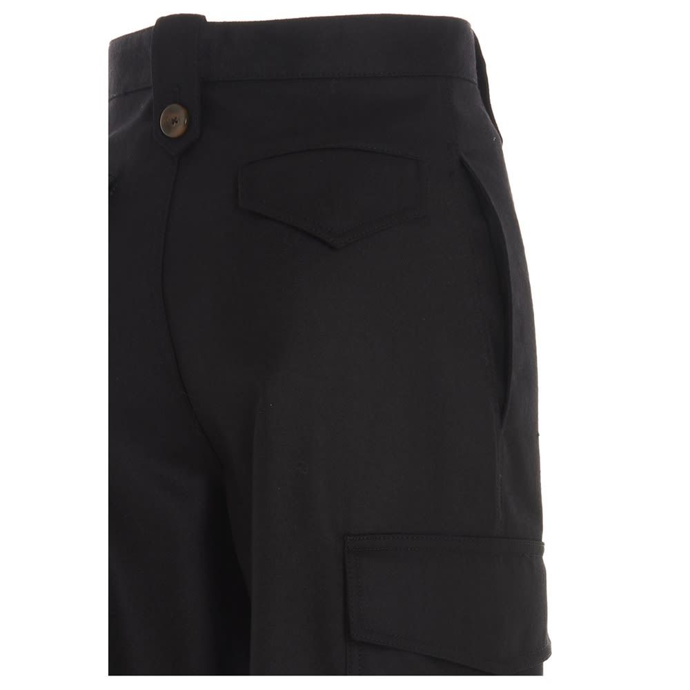 Black 
Virgin wool  

320 GR 
Flannel  
Cargo 
Applicated pockets  
High waist  
Lapel