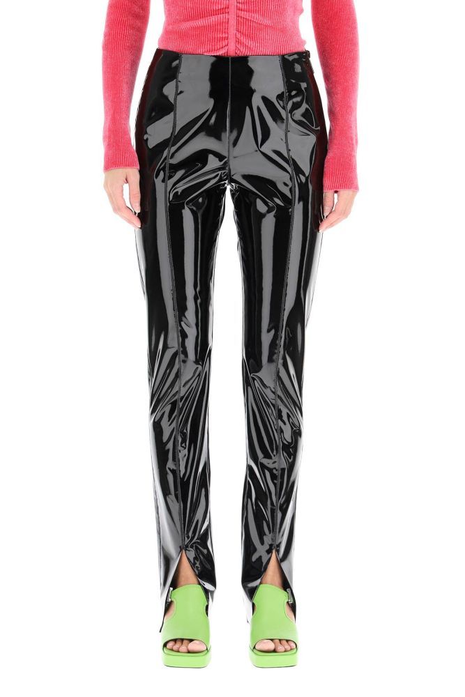 MSGM high-waisted trousers in vinyl. Straight and tapered leg cut detailed with front slits at the hem. Side invisible zip closure, laser-cut hem. The model is 177 cm tall and wears a size IT 40.