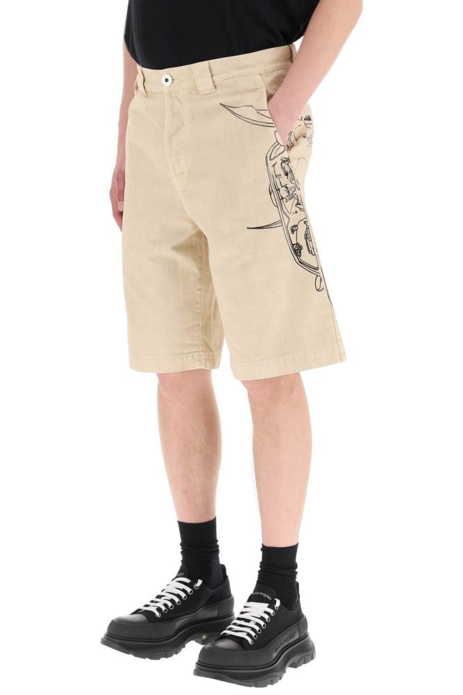 Lanvin bermuda shorts in cotton denim, enriched by side Batman print. Concealed button closure, slash pockets and tonal triangular logo embroidery on the rear patch pocket. Welt pocket at back. Relaxed fit. The model is 187 cm tall and wears a size 31.