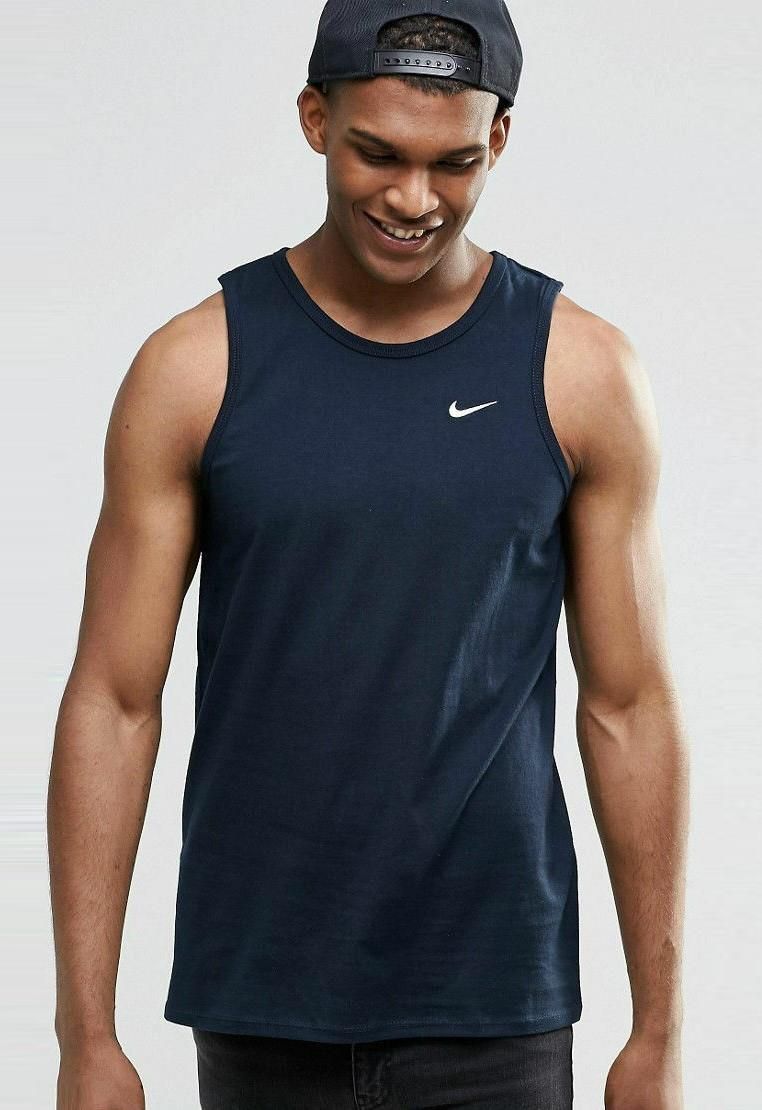 Nike Mens Sleeveless Tank Top.       
Athletic Cut, Classic Style.      
Crew Neck Muscle Tank Ideal for Sports and Casual Wear, It Features a Bold Retro Look.      
Soft-Touch Jersey Crew Neck Logo Print Regular Fit.      
Breathable Cotton, Crew Neck, Printed Design.      
Regular Fit - True to Size.      
Nike Retro Big Logo Embroidered Swoosh Vest.