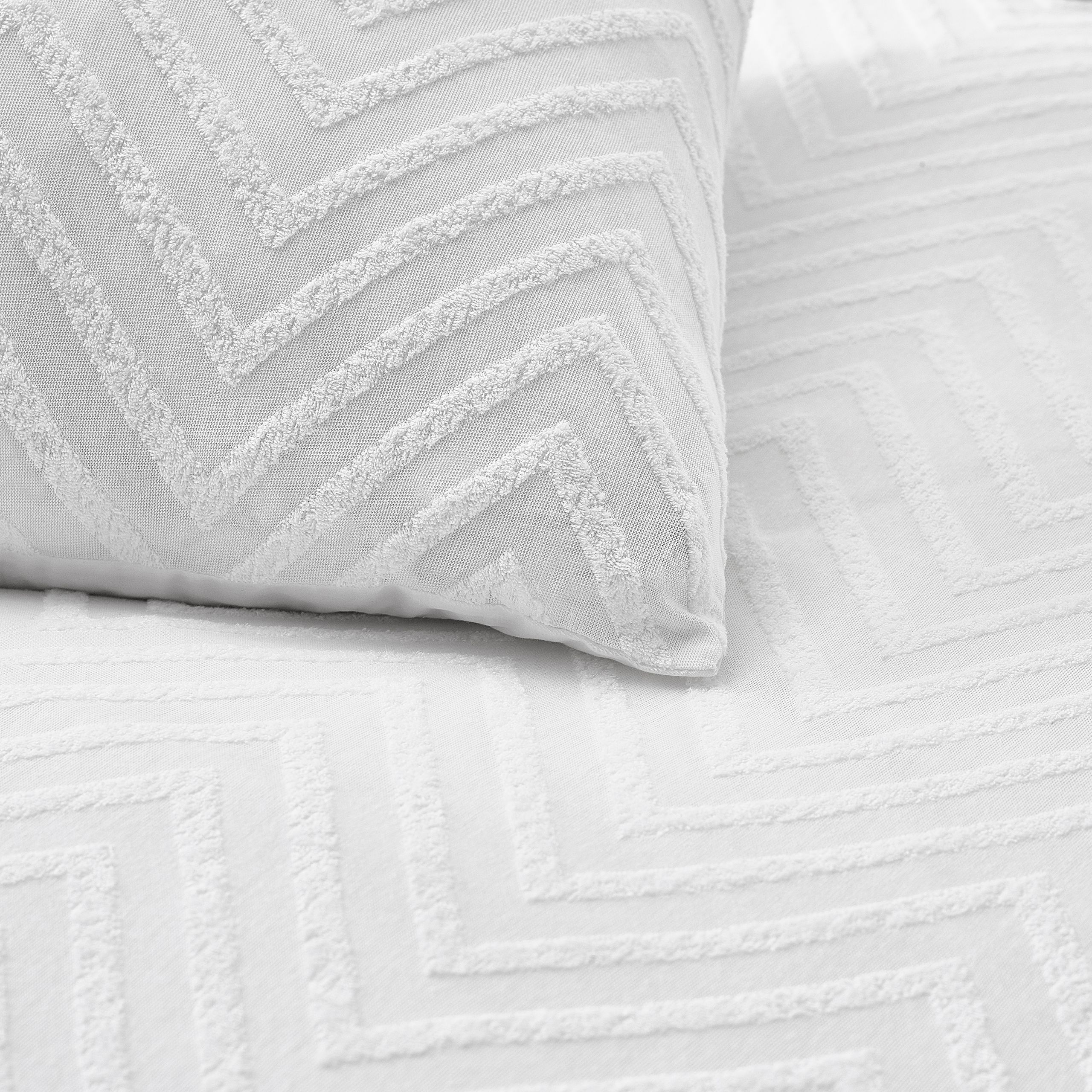 Add texture to your home with the Chevron Tuft duvet cover set. Made with 100% cotton and featuring an angular tufting detail, our chevron bedding will add a cosy, textural look to your bedroom. With a comfortable, breathable cotton percale reverse to help you have a better night’s sleep, this bedding feels as good as it looks.  Includes 1 x pillowcase measuirng 50 x 75cm.