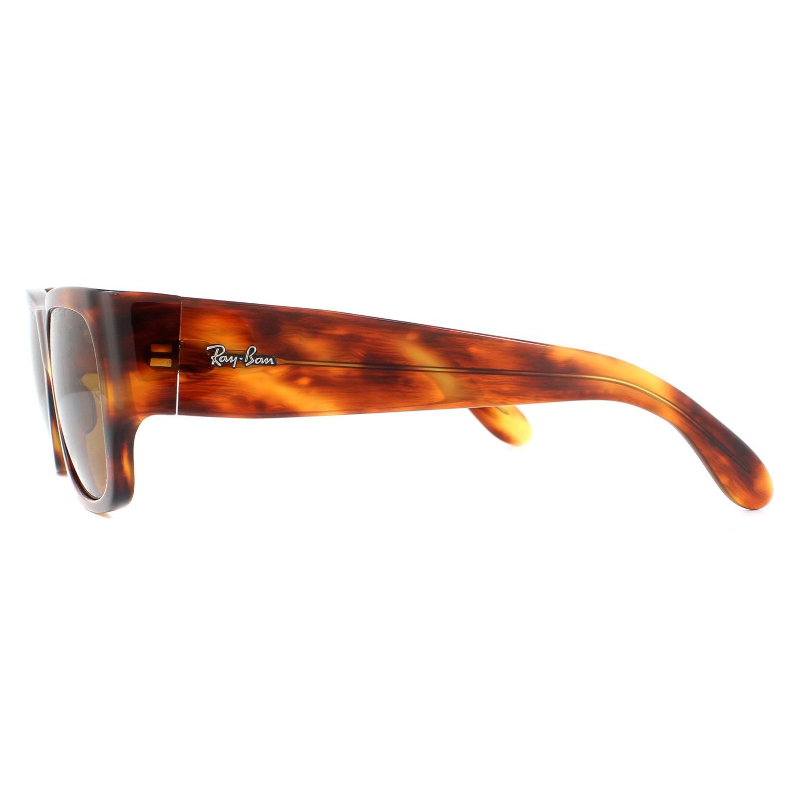 Ray-Ban Sunglasses Nomad RB2187 954/33 Striped Havana Brown B-15 are a bold style originally from the 70's featuring distinctive square lenses and super thick temples embellished with the Ray-Ban logo.