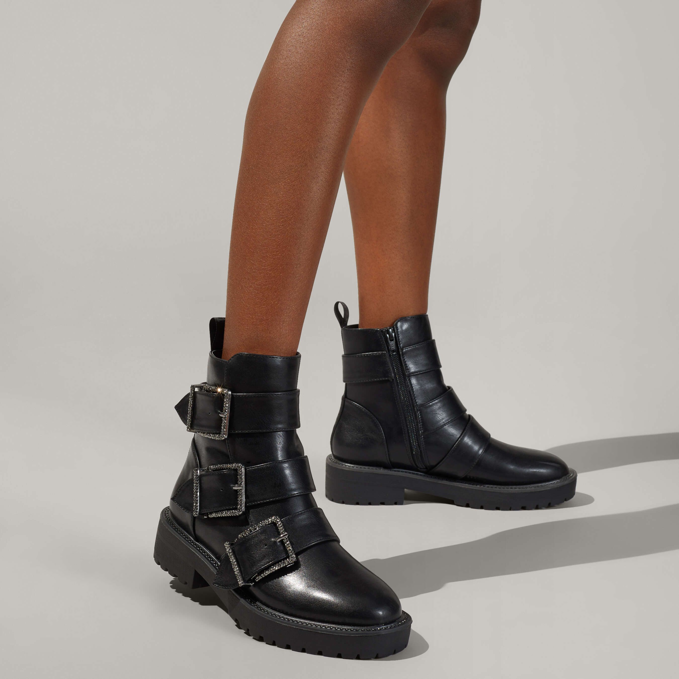 The Trixie2 ankle boot arrives in black with three straps across the foot that are fastened with crystal covered buckles. The KG Kurt Geiger logo printed on ribbed textile with a print stitch detailing is seen at the back of the ankle.