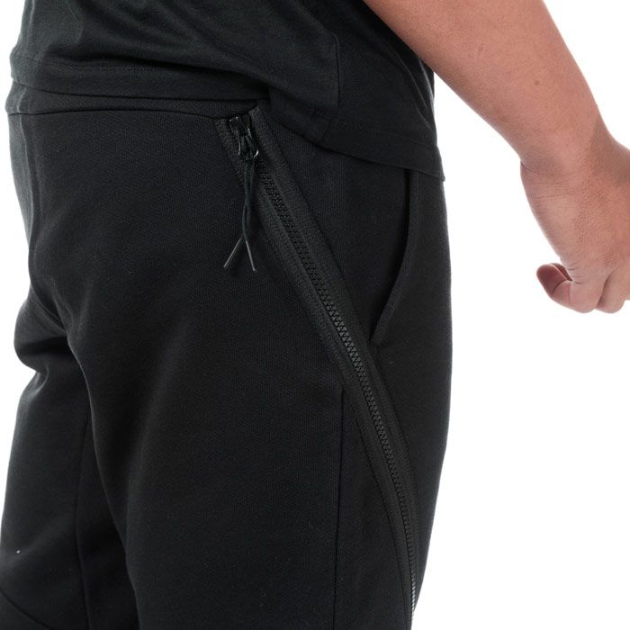 Mens C.P. Company Diagonal Fleece Jog Pants  Black. <BR><BR>- Constructed from a soft cotton.<BR>- Relaxed and comfortable fit. <BR>- Tapered ankle. <BR>- Elasticated waistband for a precise fit. <BR>- Symmetrical side pockets & large zip pockets. <BR>- Iconic Lens detailing for brand recognition on right front leg.<BR>- 100% cotton. Machine washable.<BR>- Ref: 09CMSP029A999
