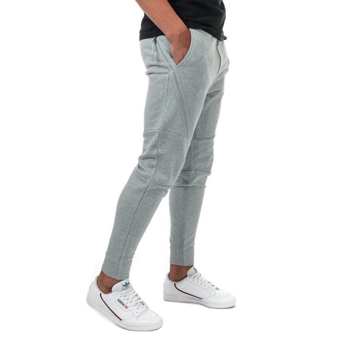 Mens C.P. Company Diagonal Fleece Jog Pants  Grey. <BR><BR>- Constructed from a soft cotton.<BR>- Relaxed and comfortable fit. <BR>- Tapered ankle. <BR>- Elasticated waistband for a precise fit. <BR>- Symmetrical side pockets & large zip pockets. <BR>- Iconic Lens detailing for brand recognition on right front leg.<BR>- 100% cotton. Machine washable.<BR>- Ref: 09CMSP029AM93