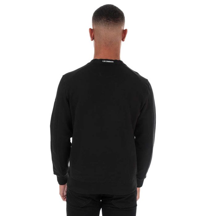 Mens C.P. Company Arm Lens Sweatshirt  Black. <BR><BR>- Long sleeves.<BR>- Crew neckline.<BR>- Features a zipped pocket on the left sleeve.<BR>- Completed with brands signature goggle logo badge lens within the sleeve zip pocket. <BR>- Regular fit.<BR>- 100% cotton. Machine washable.<BR>- Ref: 09CMSS039A999.