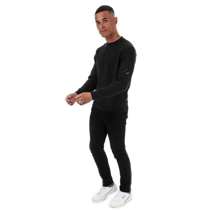 Mens C.P. Company Arm Lens Sweatshirt  Black. <BR><BR>- Long sleeves.<BR>- Crew neckline.<BR>- Features a zipped pocket on the left sleeve.<BR>- Completed with brands signature goggle logo badge lens within the sleeve zip pocket. <BR>- Regular fit.<BR>- 100% cotton. Machine washable.<BR>- Ref: 09CMSS039A999.