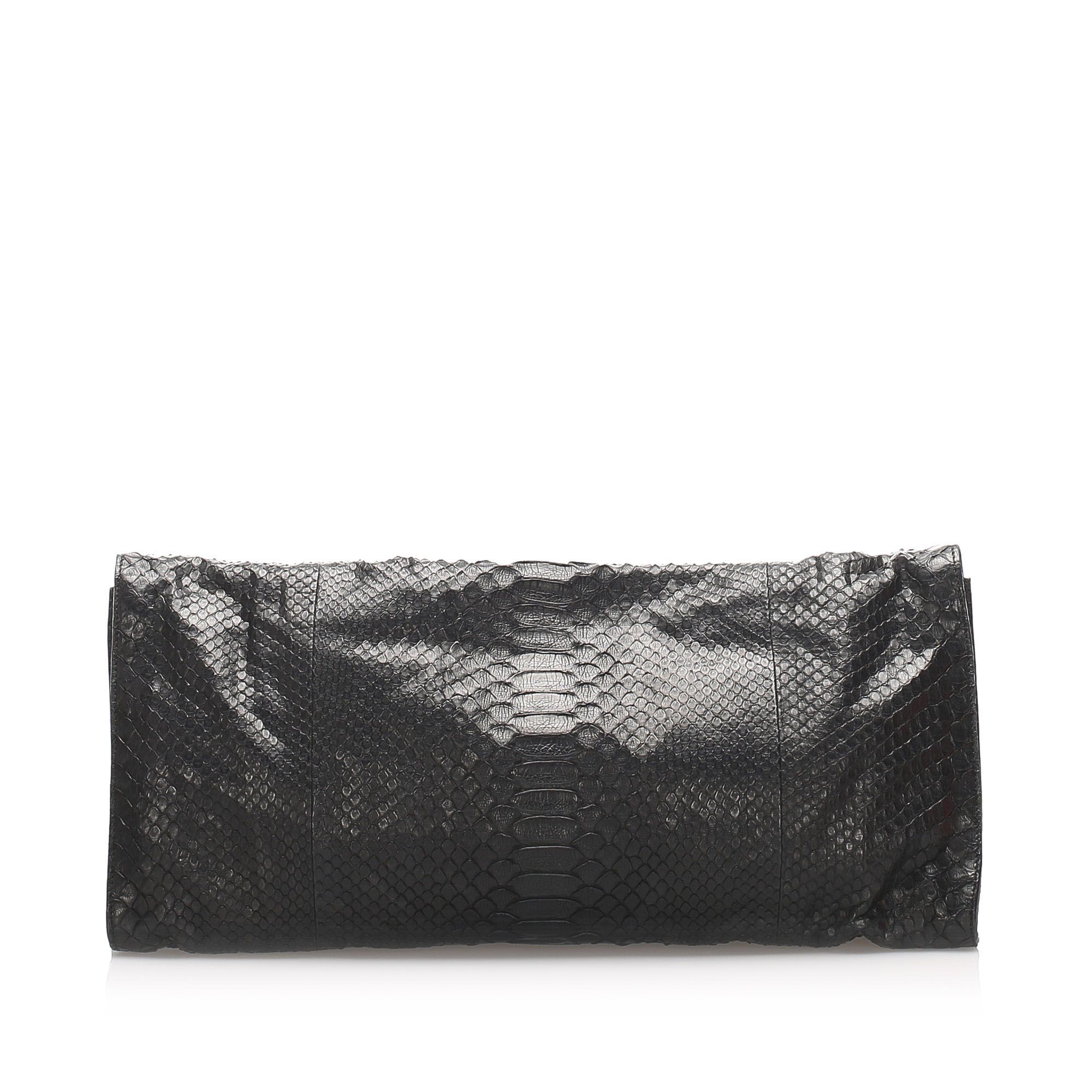 VINTAGE. RRP AS NEW. The G Night Clutch bag features a python leather body, a front flap with a magnetic closure, and an interior slip pocket.Exterior back is discolored. Exterior bottom is discolored. Exterior corners is discolored. Exterior front is discolored. Exterior side is discolored.

Dimensions:
Length 22cm
Width 46cm
Depth 2.5cm

Original Accessories: This item has no other original accessories.

Serial Number: 228574 486626
Color: Black
Material: Leather x Python Leather
Country of Origin: ITALY
Boutique Reference: SSU74296K1342


Product Rating: GoodCondition