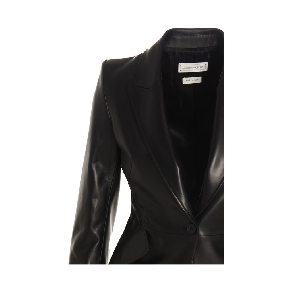 Single breast lambskin blazer jacket featuring couture seams at the back, long sleeves with padded shoulders, peak lapels and a button closure.