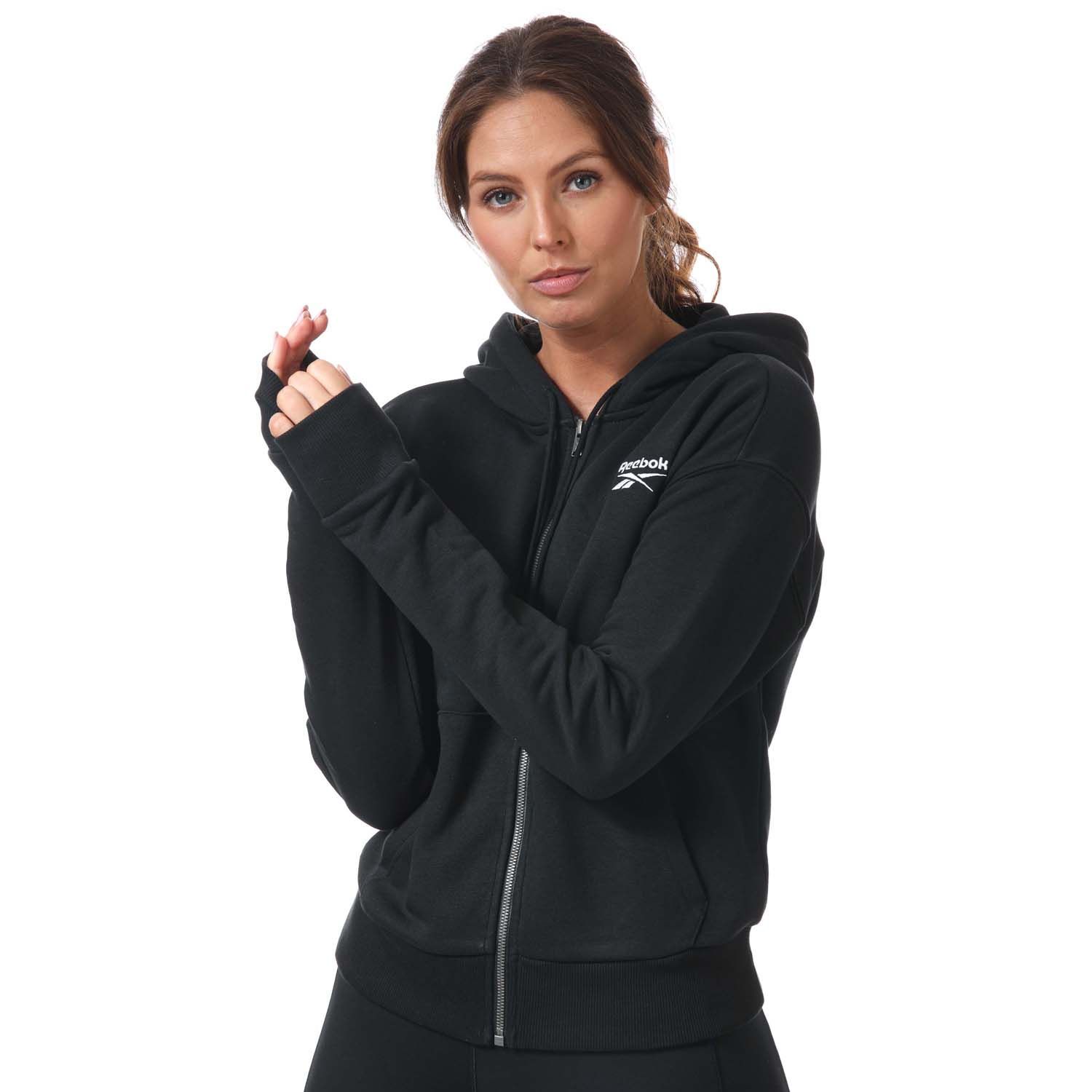 Womens Reebok Identity Zip- Up Track Top in black.- Drawcord-adjustable hood.- Long sleeves with ribbed cuffs.- Full zip fastening.- Kangaroo pocket.- Ribbed hem.- Small logo.- Oversize fit.- Main Material: 80% Cotton  20% Polyester (Recycled). Rib Part: 95% Cotton  5% Elastane. - Ref:GL2561