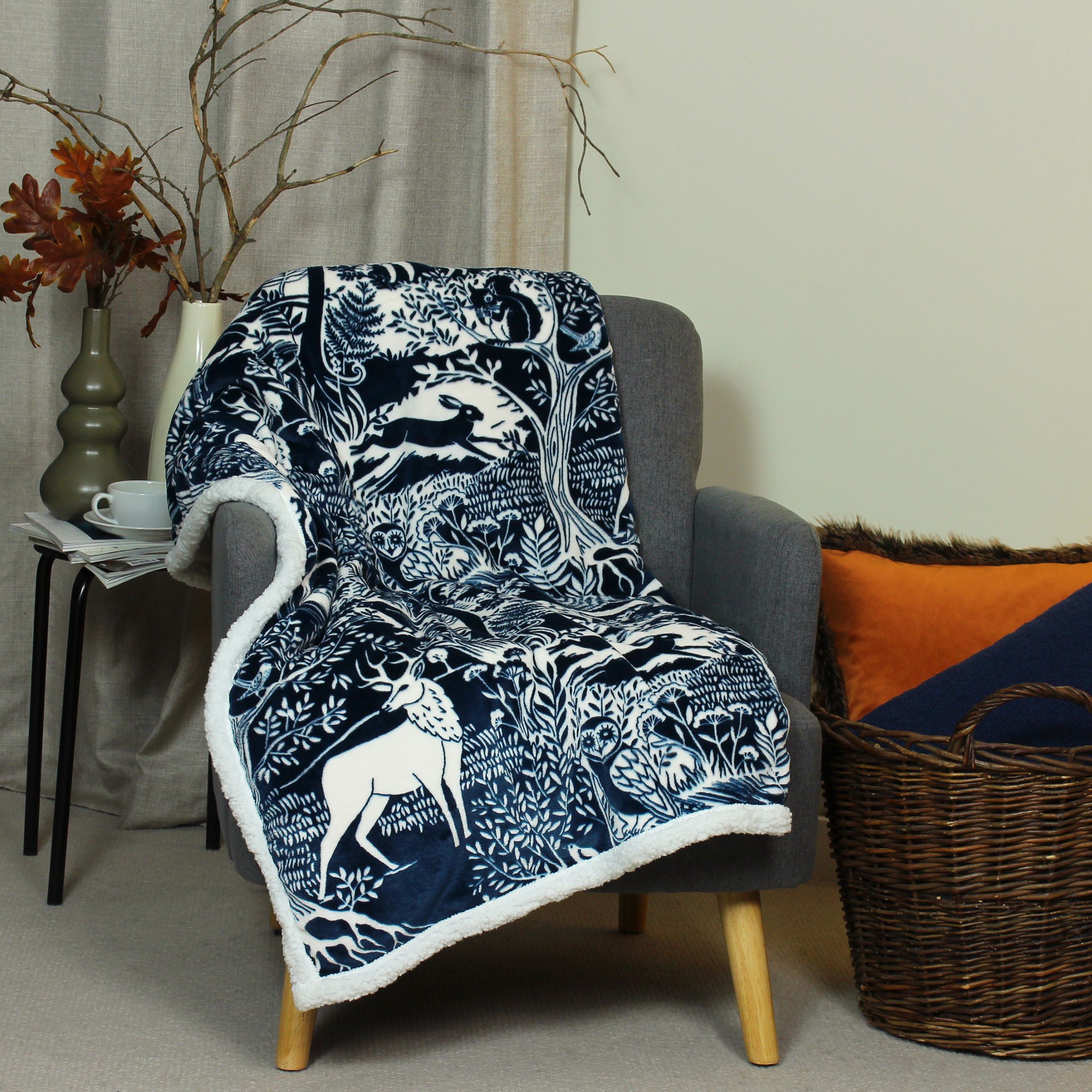 Invite nature into your home with winter woods throw. The design features a stunning woodblock inspired print with plenty of woodland animals and trees. Created with luxurious 230gsm microfleece for a super soft front that emanates an opulent sheen. With a 230gsm sherpa reverse in a optic white you'll be keeping toasty warm all night long.