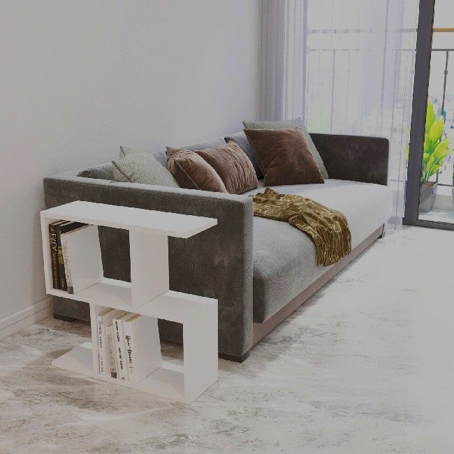 This coffee table, elegant and functional, is the perfect solution to furnish the living area and to keep magazines and small objects tidy. Mounting kit included, easy to clean and easy to assemble. Color: White | Product Dimensions: W60xD20xH59,4 cm | Material: Melamine Chipboard | Product Weight: 8,4 Kg | Supported Weight: 25 Kg | Packaging Weight: 9 Kg | Number of Boxes: 1 | Packaging Dimensions: 63,6x23,6x9 cm.