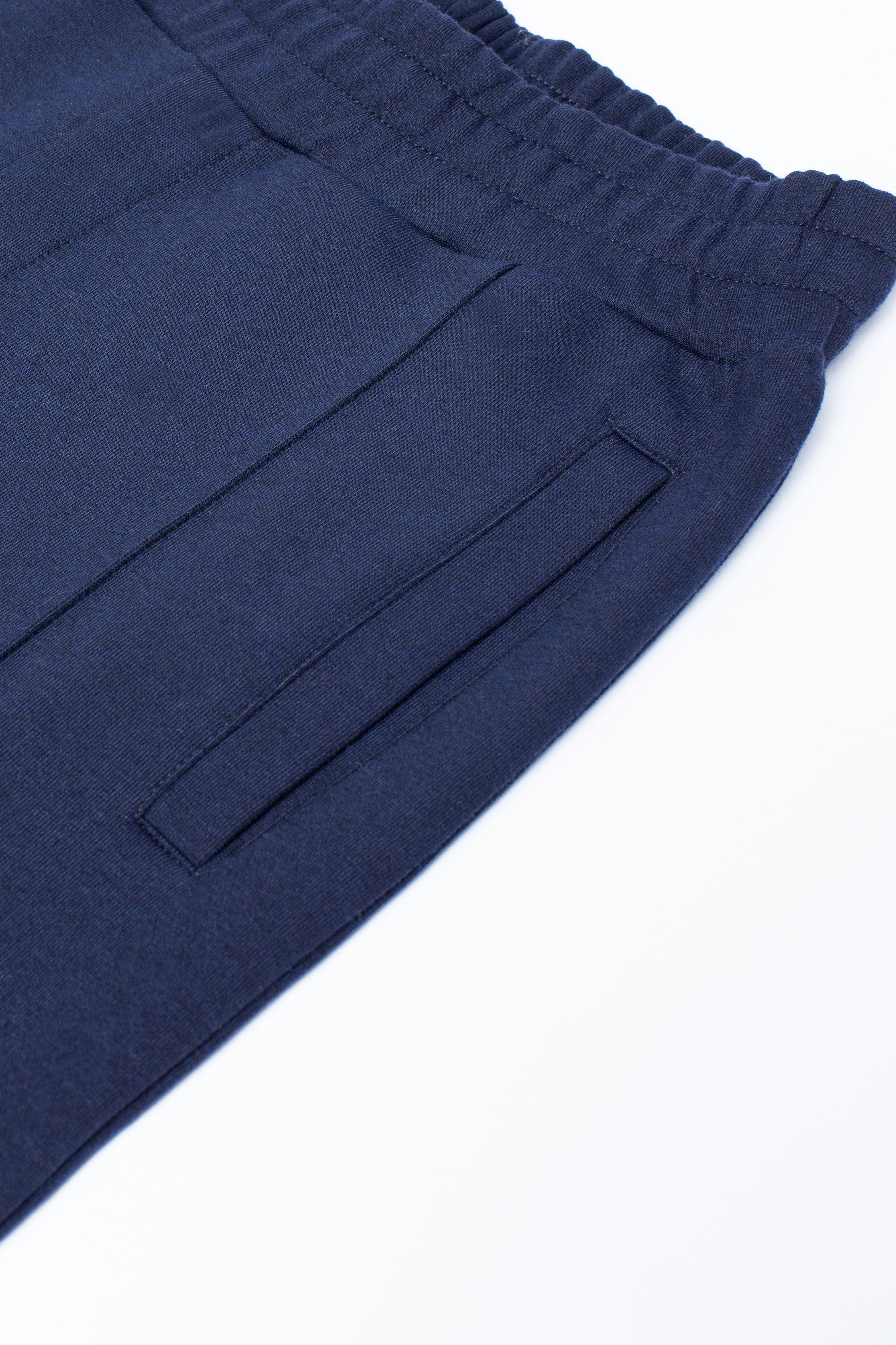 The HYPE. Epworth Joggers are your go-to summer staple. Designed in a 80% cotton and 20% polyester fabric base for the ultimate comfort. With drawstring pullers and an elasticated waistband. Finished with a stitched pleat detailing in a royal navy colour palette. Wear with the matching hoodie to complete the look. Machine washable.