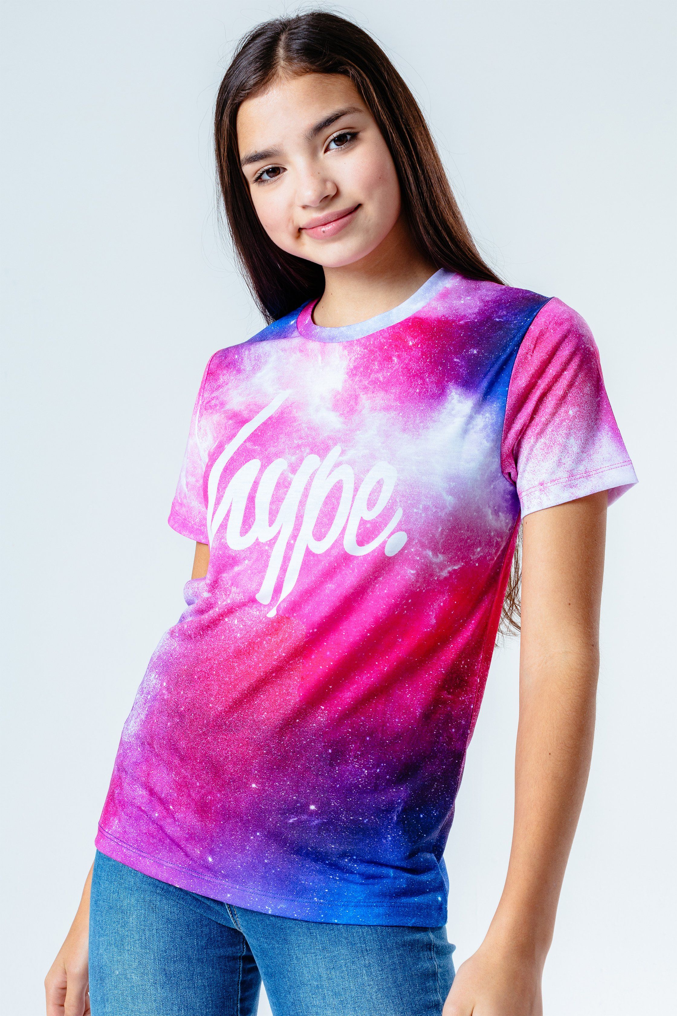 The HYPE. Pink System Kids T-Shirt features a purple, pink and white colour palette. In our standard kids tee shape in a 95% polyester and 5% elastane fabric base for the ultimate comfort. Finished with a crew neckline and short sleeves with the iconic HYPE. script logo in a contrasting white on the front. The design features a galaxy and galactic inspired all over print. Wear with black denim jeans to complete the look. Machine wash at 30 degrees.