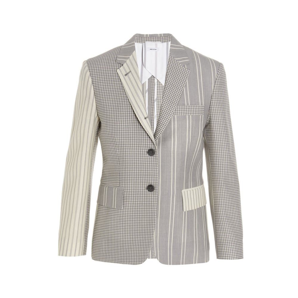 Single-breasted wool patchwork blazer jacket with long sleeves, padded shoulders and two back splits.