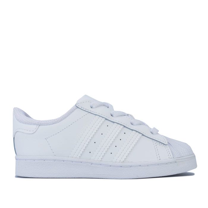 Infant adidas Originals Superstar Trainers in footwear White. – Smooth coated leather upper. – Elasticated lace closure for easy on-off. – Classic rubber shell toe. – Padded collar and tongue. – Tonal 3-Stripes to sides and printed ‘Superstar’ wordmark. – Tonal print Trefoil branding to tongue. – Tonal heel patch with embossed Trefoil logo. – Comfortable textile lining. – Removable Ortholite sockliner for comfort and odour control. – Herringbone-pattern rubber cupsole. – Includes set of regular laces. – Leather and synthetic upper – Textile lining – Synthetic sole. – Ref: EF5397