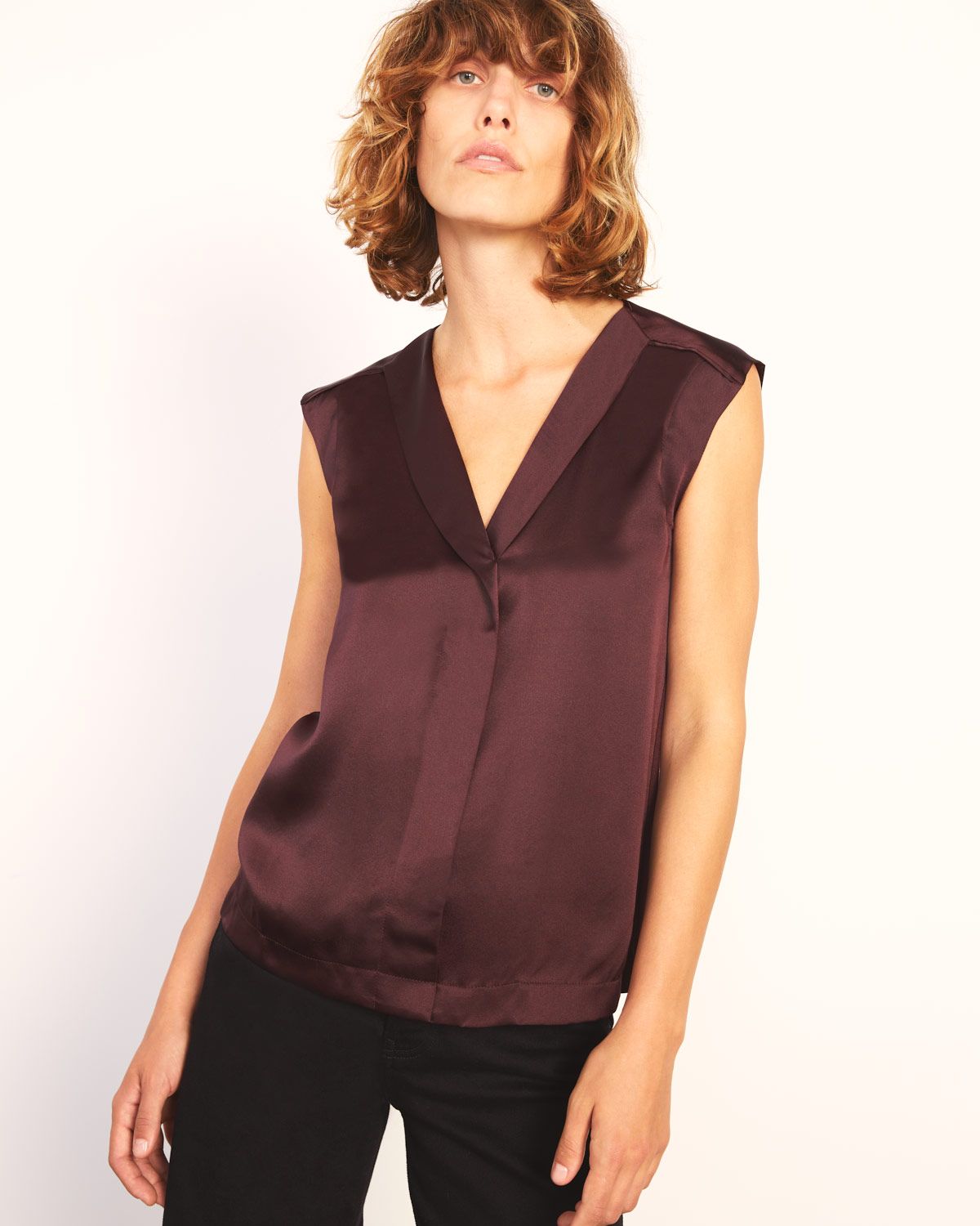 Sophisticated silk shirt with 100% silk satin front and soft modal jersey back. Relaxed fit with flattering V-shaped neckline. Wear for work with tailored trousers or style with jeans for a casual look.