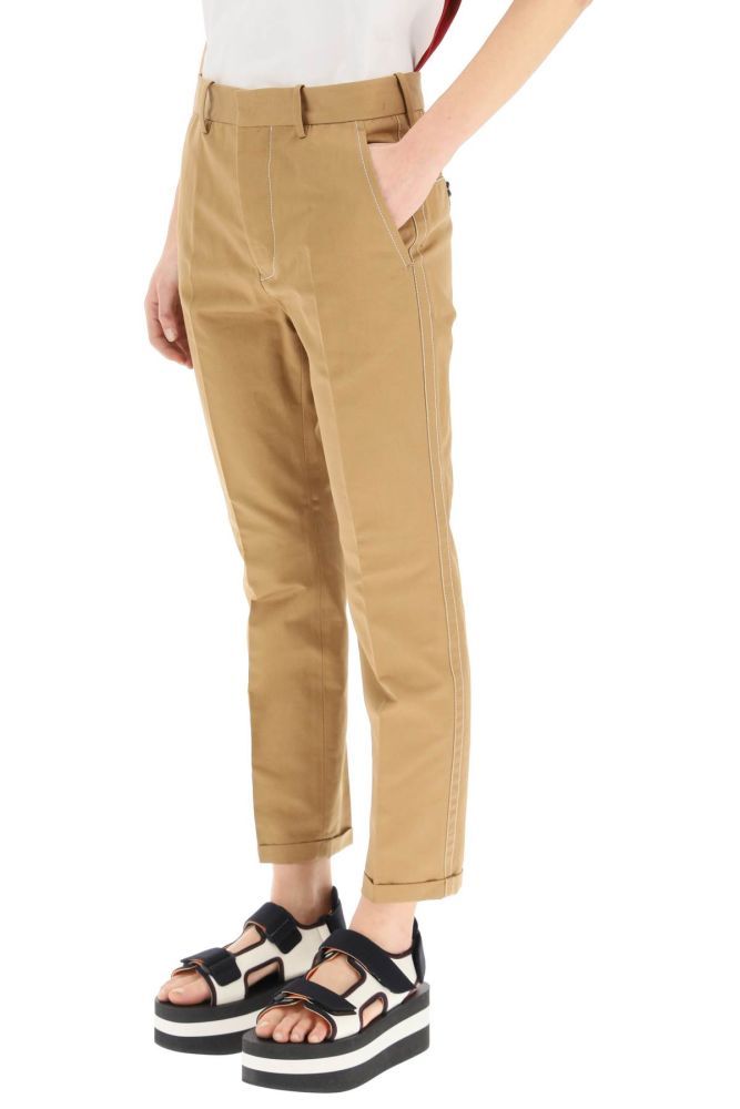 Marni trousers in organic cotton and linen drill, finished with contrast topstitching. Slim fit, side slanted pockets, back bound pockets with button, concealed zip and hook closure, cuffed leg. The model is 177 cm tall and wears a size IT 38.