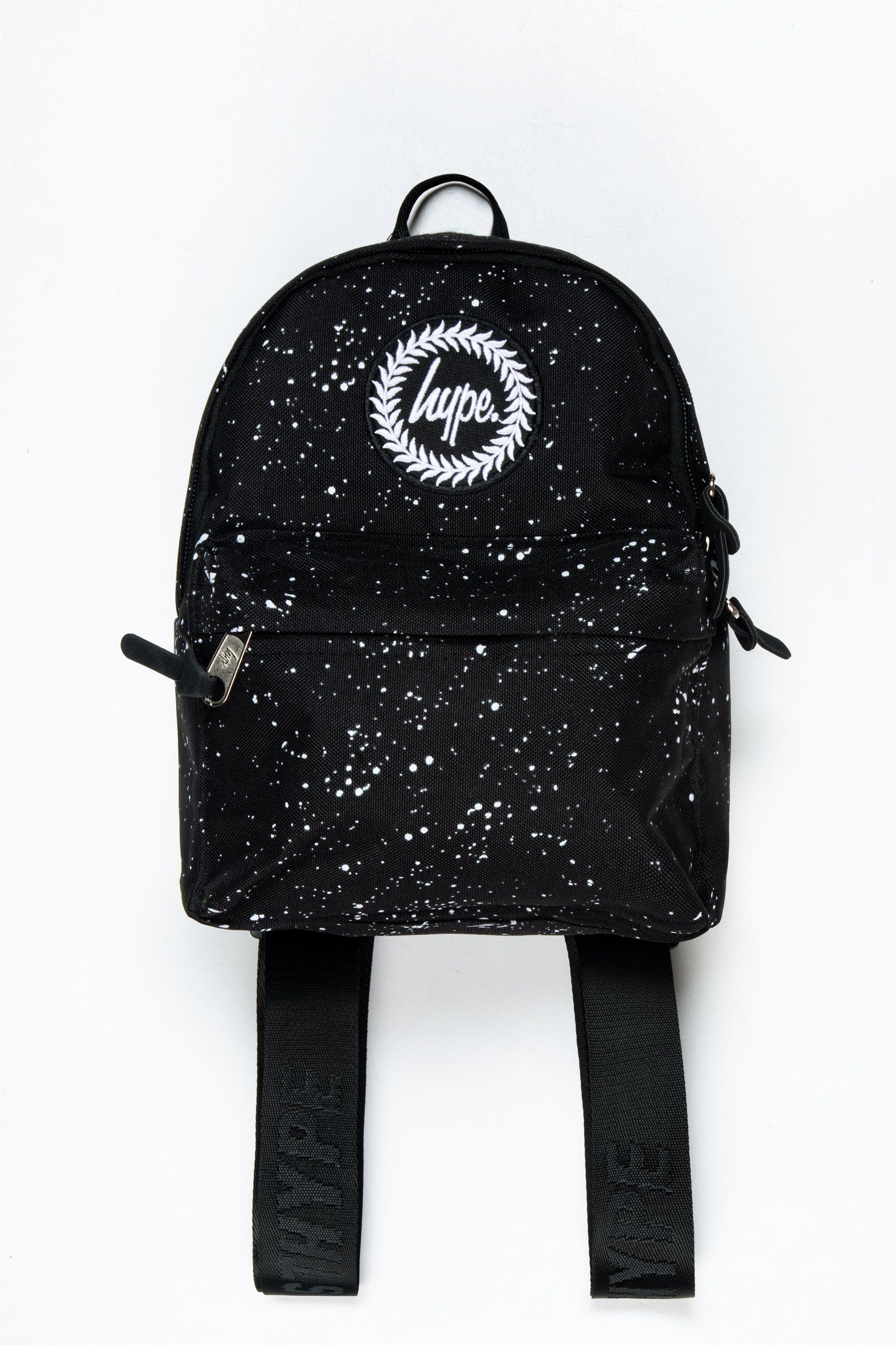 Introducing the HYPE. Black Speckle Mini Backpack, if you're reading this, then you want to know more. Our standard unisex mini backpack shape and style features our signature speckle fade all-over print in a monochrome colour palette. This backpack is the ultimate essential mini bag to transport your everyday essentials, this bag is smaller than our standard backpacks. With embossed adjustable straps with the perfect amount of padding. Finished with the iconic HYPE. crest logo embroidered on the front. Wipe clean only.