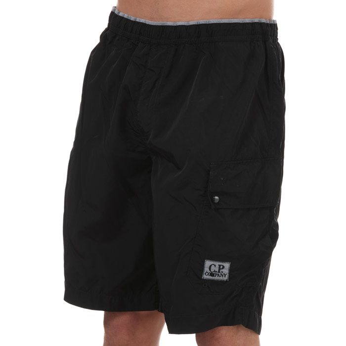 Mens C.P. Company Swim Shorts in black.<BR>- Elasticated waist with drawstring.<BR>- Side pocket.<BR>- Brand's logo to the left leg.<BR>- Mesh lining. <BR>- 100% Polyamide. Machine washable.<BR>- Ref: 10CBMW246A999