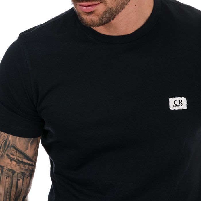 Mens C.P. Company Small Stitch Block Logo T- Shirt in navy. – Crew neckline. – Short sleeves. – Appliqué branding. – C.P. Company logo. – Regular fit.  – 100% Cotton.  Machine wash at 30 degrees. – Ref: 10CMTS063W888