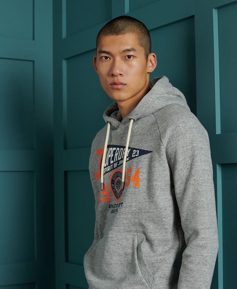 Update your hoodie collection this season with the Mascot University Overhead Hoodie, featuring a collegiate design. Perfect for layering up with a fleece lining, style over a classic tee with jeans and trainers to complete the look.Slim fit – designed to fit closer to the body for a more tailored lookDrawstring hoodFleece liningFront pouch pocketRibbed cuffs and hemPrinted Superdry graphicSignature logo patch