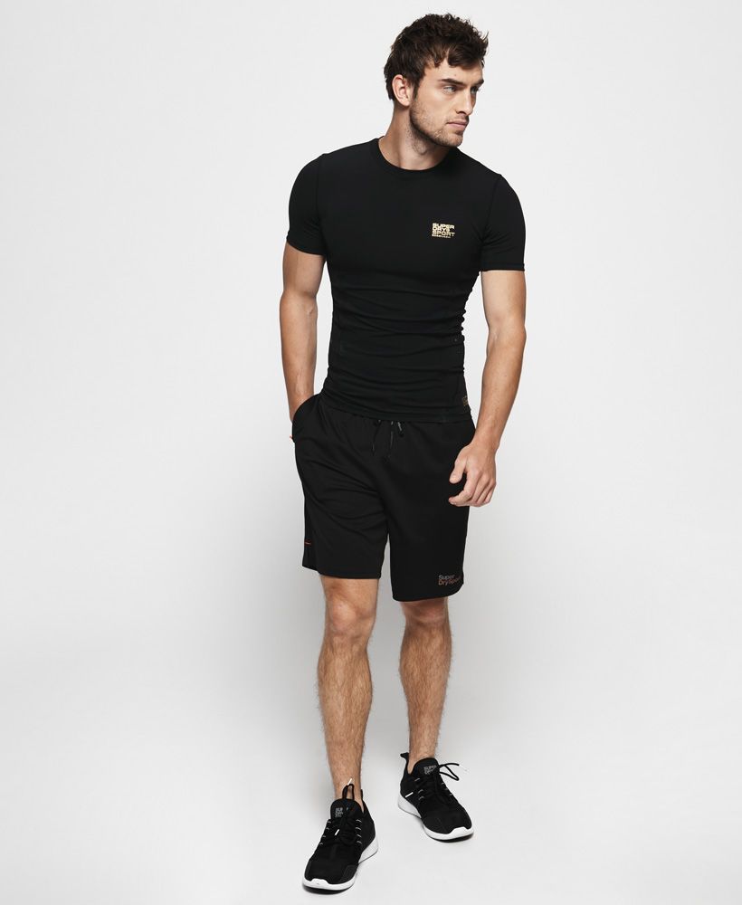 Superdry men's Performance compression short sleeve top. Combining style with technical performance, this short sleeve compression top has been crafted from a breathable fabric using moisture wicking technology to keep you dry and comfortable as you workout. Flatlock seams offer additional strength and support while ventilation detailing in the sides help to increase airflow. This top has been completed with a Superdry Sport logo on the chest and above the hem.