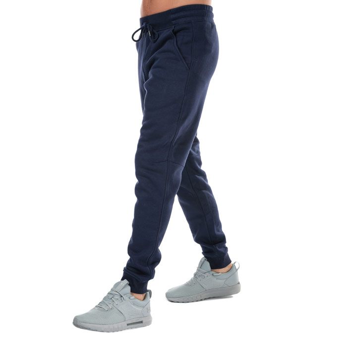 Mens Under Armour UA Rival Fleece Fitted Jog Pants in navy.<BR><BR>- ColdGear fabric traps heat and wicks sweat to keep you warm  dry and light.<BR>- Super soft  cotton-blend fleece with brushed interior for extra warmth.<BR>- Elasticated waist with drawcord.<BR>- Mock fly detail.<BR>- Front slant pockets.<BR>- Rear pocket with snap closure.<BR>- Under Armour branding at right thigh.<BR>- Tapered leg.<BR>- Ribbed cuffs.<BR>- Fitted fit; next to skin without the squeeze.<BR>- 80% Cotton  20% Polyester.  Machine washable.<BR>- Ref: 1309818-410