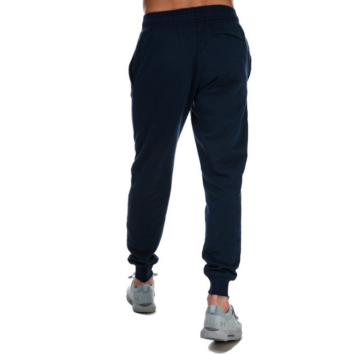 Mens Under Armour Rival Fleece Jog Pants in navy.<BR><BR>-  Inner drawcord to the waistband.<BR>- Ribbed cuffs and waistband.<BR>- Two side pockets.<BR>- Iconic branding to the right leg.<BR>- Ultra-soft  mid-weight cotton-blend fleece with brushed interior for extra warmth.<BR>- 80% Cotton  20% Polyester.  Machine washable. <BR>- Ref: 1357128408