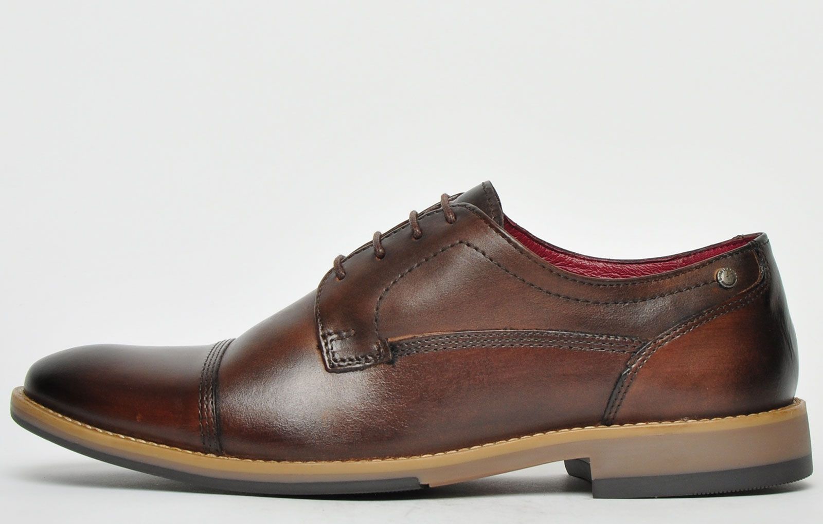 With a vintage classic finish to its premium leather upper, these Base London Thorpe are the perfect choice for formal and casual wear. The perfect shoe for the modern gentlemen, sophisticated, and built to last. Giving timeless style with a premium leather upper the Thorpe showcases classic high end detailing, finished with a slight raised heel. 
 - Premium leather uppers
 - Classic design
 - Intricate designer stitch detailing
 - Lace up fastening
 - Leather/textile lining
 - Durable outsole
 - Base London branding throughout