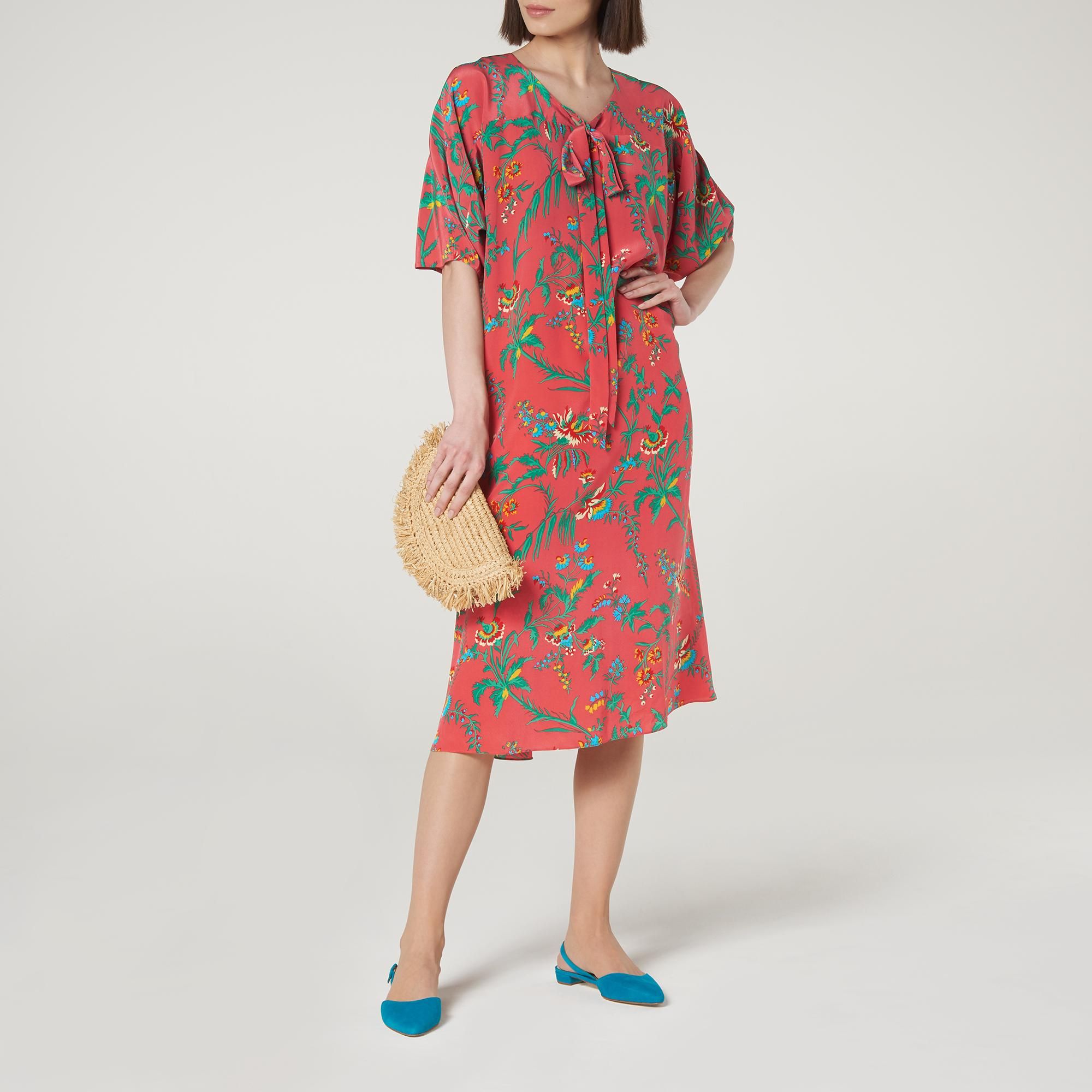 Offering colour and print to your spring wardrobe, Our Estella midi dress is perfect for seasonal sunshine. Crafted from pure silk in our bohemian wildflower print in garden pink, it has a round neck with pussy bow detail, a loose silhouette and pleated short sleeves. Wear it with simple slides and a raffia handbag for an easy, everyday look.