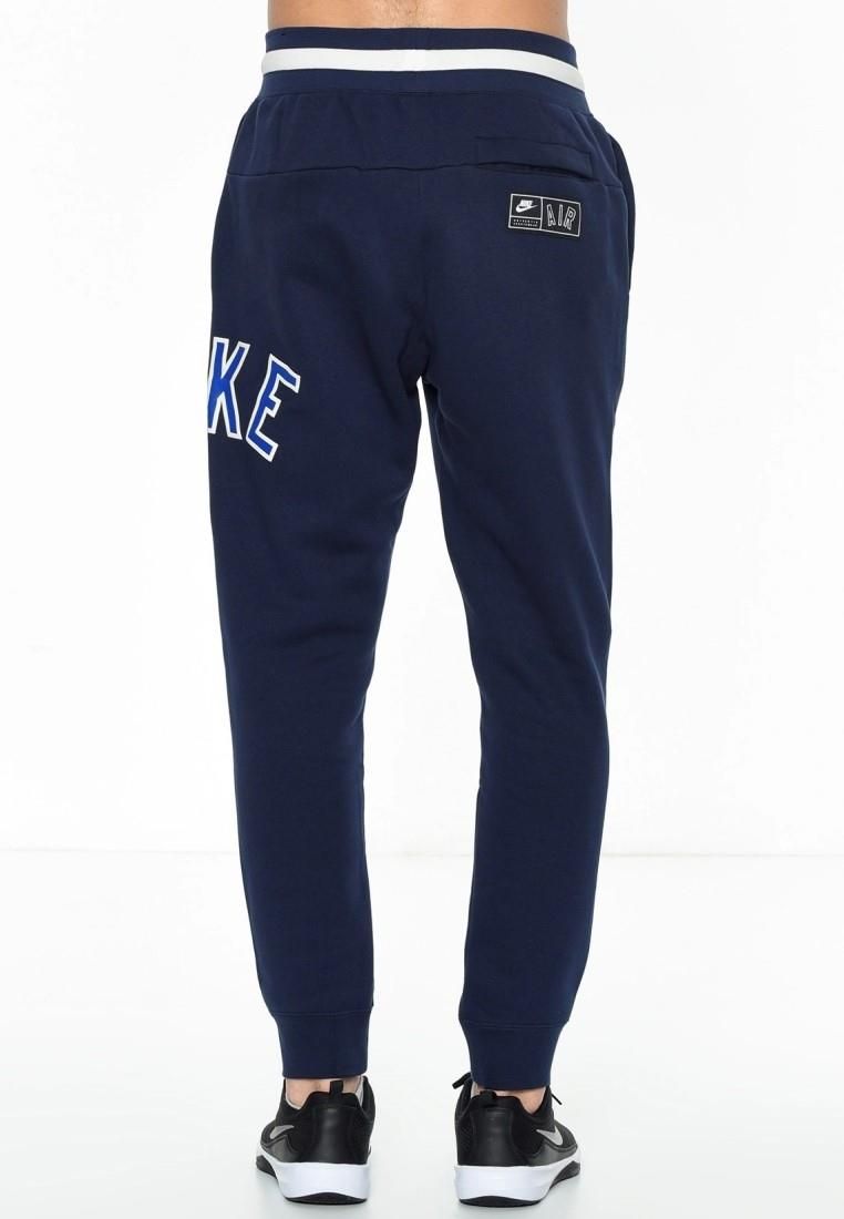 Nike Air Mens Zip Through Tracksuit Set in Navy.  
Drawstring Hood, Zip Closure, Embroidered Swoosh.   
Printed Branding, Split Kangaroo Pouch Pocket.   
Woven Brand Patch, Ribbed Cuffs & Hem.  
Elasticated Waist Band.   
Elasticated Drawstring Waist Joggers.   
Ribbed Bottom Leg Cuffs for Comfort Fit.