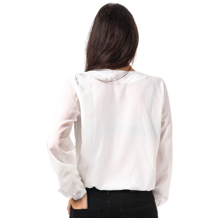 Womens Only Toscany Wrapover Blouse in cloud dancer.<BR><BR>- Flattering drapey blouse crafted in a soft silky fabric.<BR>- V-neck with wrapover design.<BR>- Long sleeves with buttoned cuffs.<BR>- Elasticated at waist.<BR>- Loose fit.<BR>- Measurement from shoulder to hem: 21in approximately.<BR>- 100% Polyester.  Machine washable.<BR>- Ref: 15162702<BR><BR>Measurements are intended for guidance only.