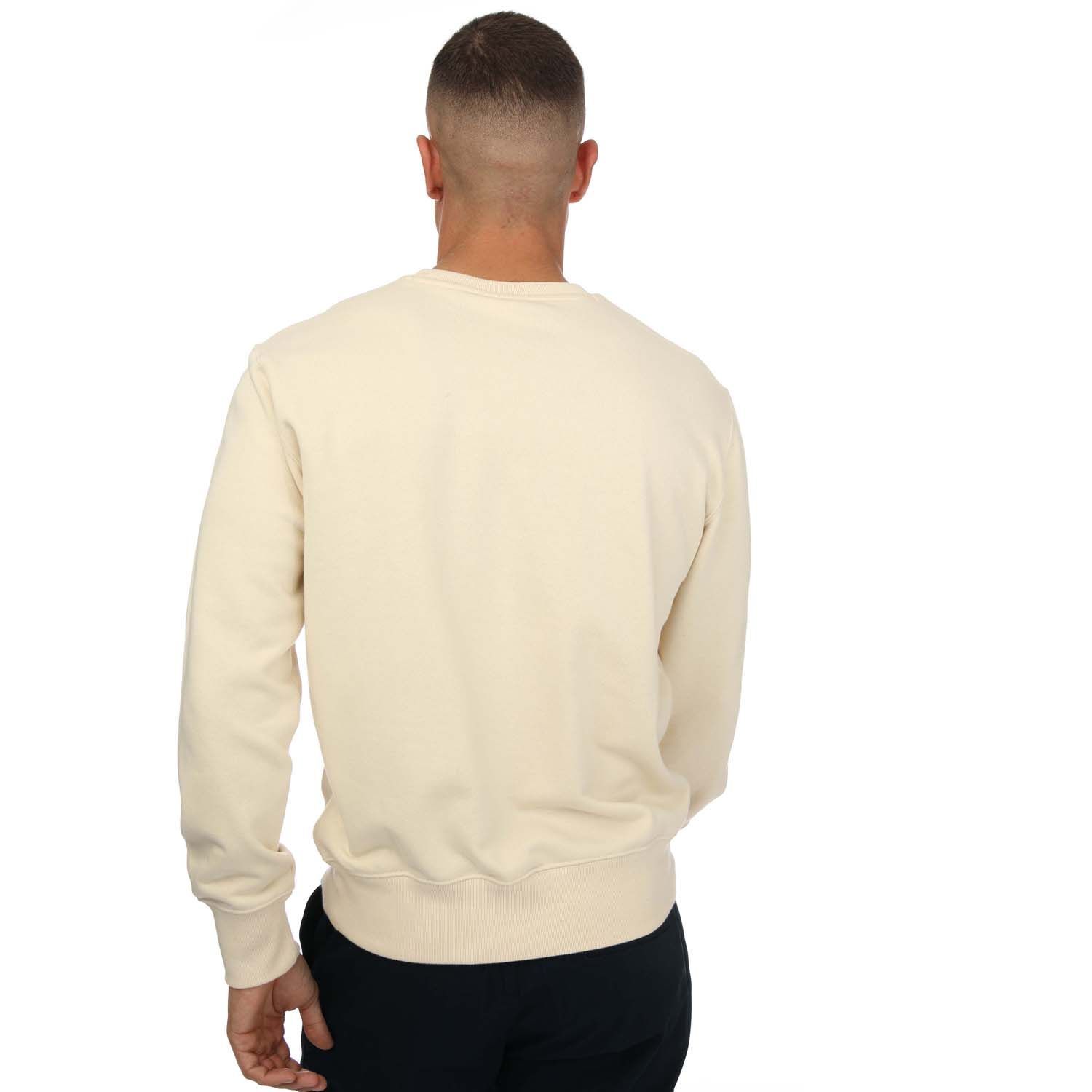 Mens Champion Crew Neck Small Script Logo Sweatshirt in sand.- Crewneck.- Ribbed elasticated waistband and cuffs.- Small script logo in tatami embroidery on chest.- C logo embroidery on left sleeve.- Comfort fit.- Body Fabric: 67% Cotton  33% Polyester. Inserts: 100% Cotton. Rib Trim: 98% Cotton  2% Elastane.- Ref: 217065YS015