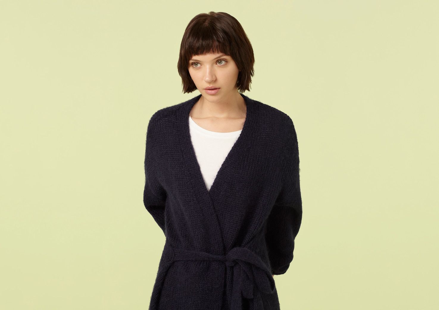 The humble cardigan gets a winter-ready makeover in the form of our Laurel design. Made from soft and cosy mohair-blend fabric, this chic longline style belts at the waist for a shapely finish or can be worn open for a loose and slouchy look.


Model is 5'7