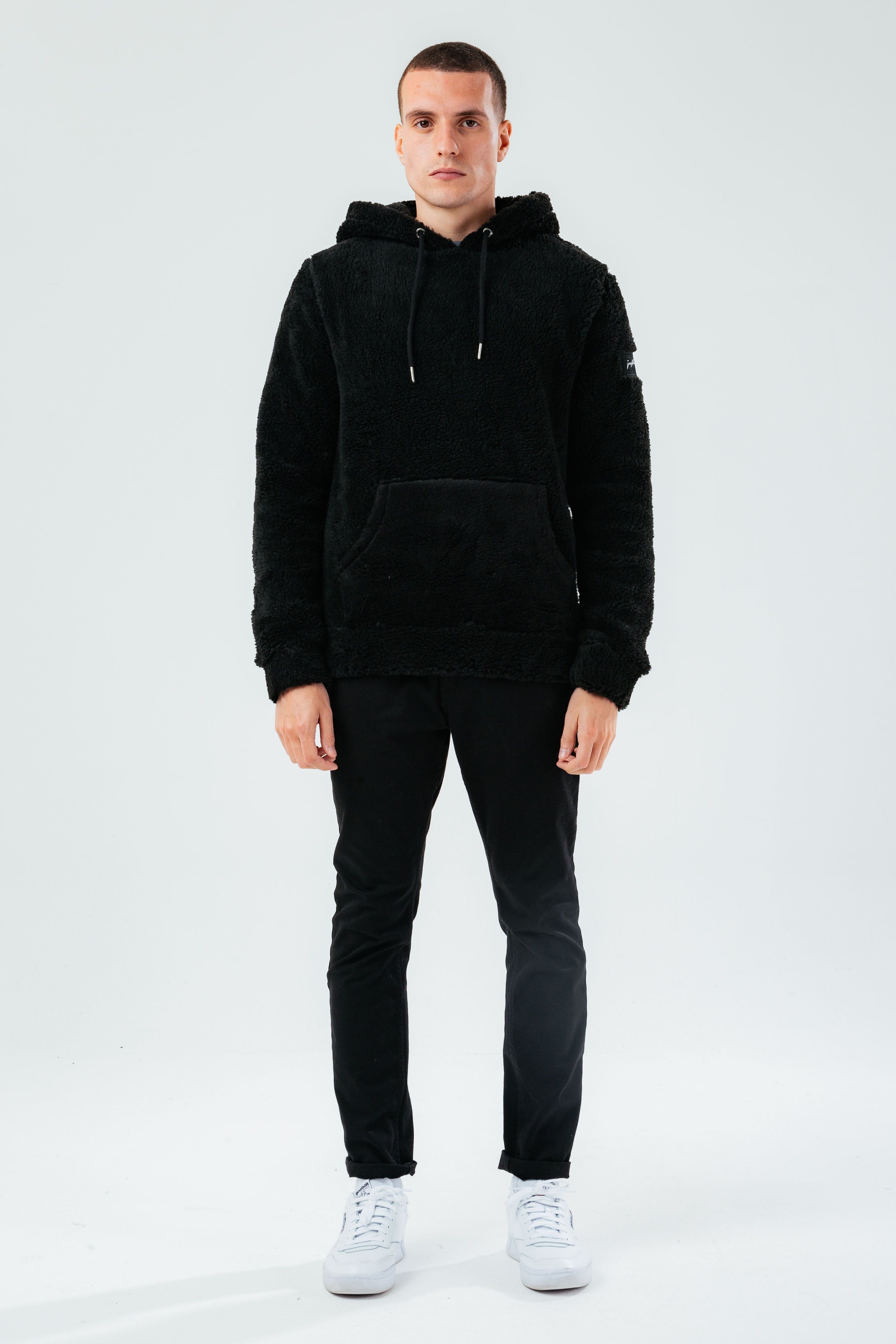 The HYPE. Men's Pullover Hoodie boasts a soft touch fabric base for supreme comfort. Designed in our standard men's pullover shape, with a fixed hood, kangaroo pocket, elasticated hem and ribbed cuffs. The model wears a size M. If you like an oversized fit, go up a size, if you like a tight fit go down a size, for a standard fit, select your usual size. Machine wash at 30 degrees.