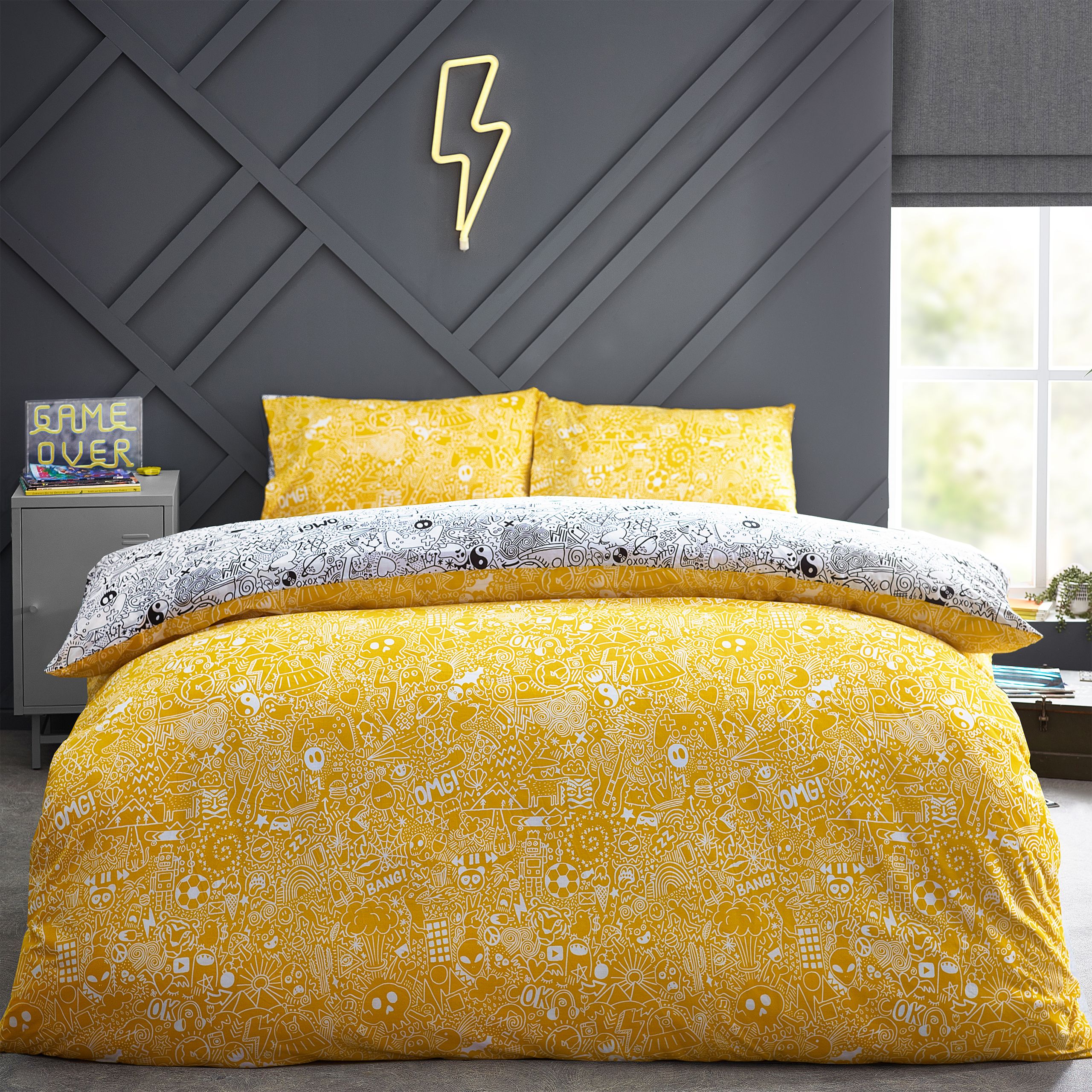 Express your creativity with this doodle duvet set. Featuring exciting notebook doodles of aliens, monsters, and spaceships. The excitement continues to the reverse a coordinating design on a yellow base so you can switch the look when you need to.