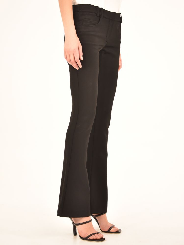 Low-waisted black trousers with flared bottom, five-pocket model with belt loops.The model is 183 tall and wears size 36FR / S / 40IT