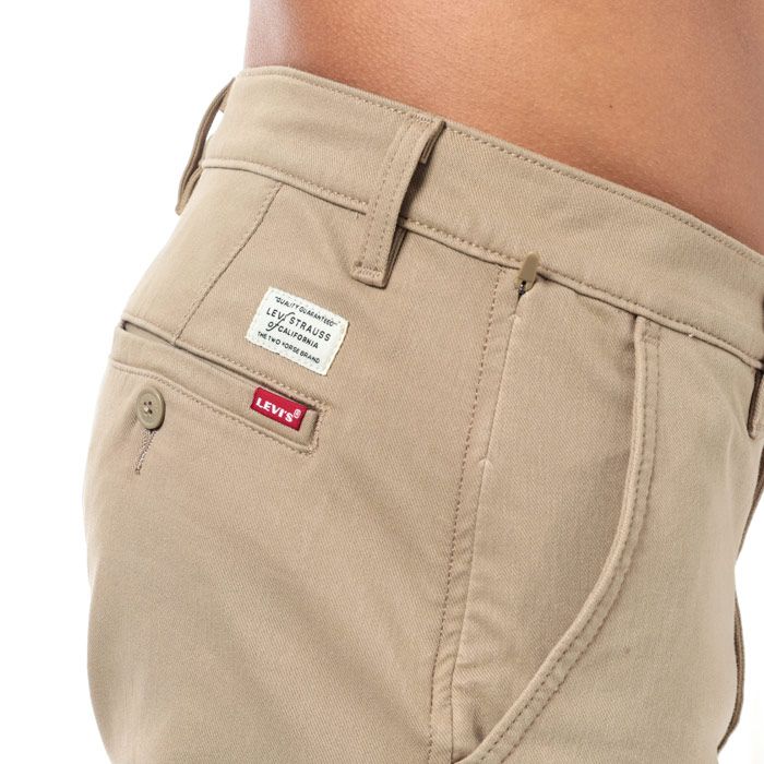 Mens Levi’s XX Chino 502 Standard Taper Shorts in true chino wonderknit.<BR><BR>- Zip fly and button fastening. <BR>- Front slant pockets with side seam zipped pocket.<BR>- Buttoned rear welt pockets.<BR>- Wonderknit fabric looks like twill but feels like a soft knit and delivers advanced comfort  mobility and 4-way stretch.<BR>- Sits at waist.<BR>- Tapers above knee.<BR>- Regular fit through seat and thigh.<BR>- Inside leg length measures 9.5in approximately.<BR>- 84% Cotton  16% Elastane. Machine washable. <BR>- Ref: 17205-0005<BR><BR>Measurements are intended for guidance only.