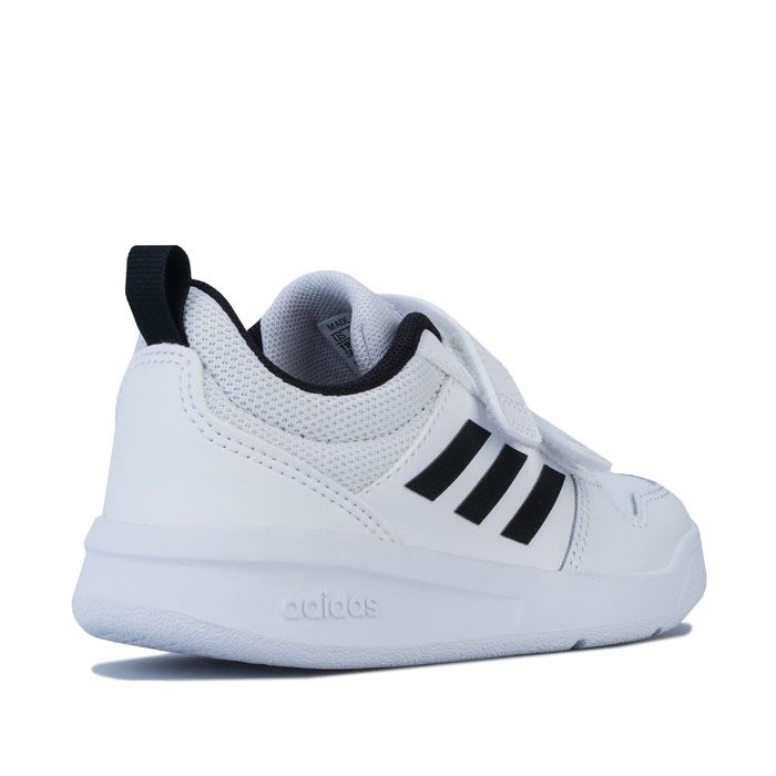Children Boys adidas Tensaurus Trainers in core Black - cloud White. – Coated leather and mesh upper. – Double hook and loop closure and webbing heel pull for easy on-off. – Padded collar and tongue. – Printed 3-Stripes to sides. – Embossed adidas branding at side heel. – Comfortable textile lining. – Removable cushioned sockliner. – Non-marking rubber outsole. – Leather synthetic and textile upper – Textile lining – Synthetic sole. – Ref: EF1093