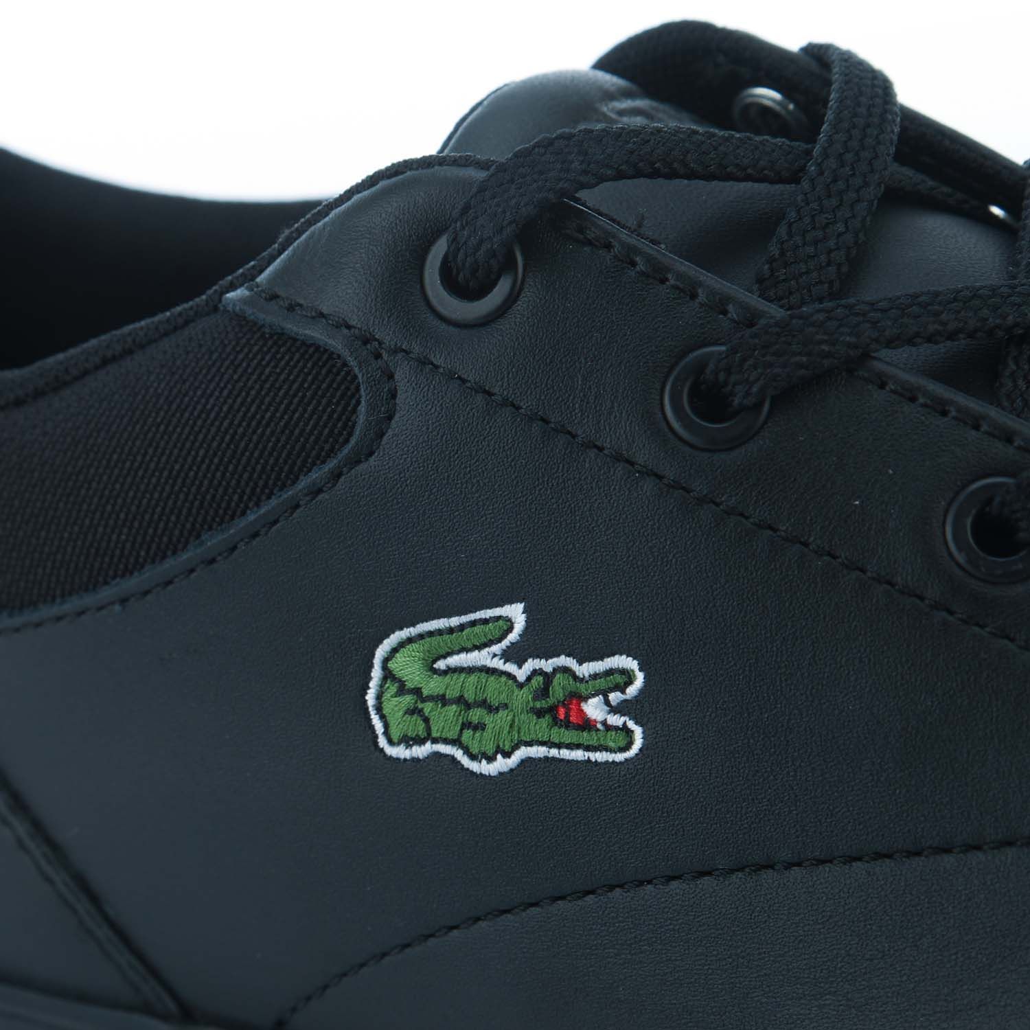 Mens Lacoste Bayliss Trainers in black.- Synthetic leather upper.- Lace up fastening.- Lace detail to the heel.- Ortholite® insole.- Tonal embroidered tongue branding.- Embroidered branding. - Rubber sole.- Leather upper  Textile lining  Synthetic sole.- Ref: 743CMA004802H