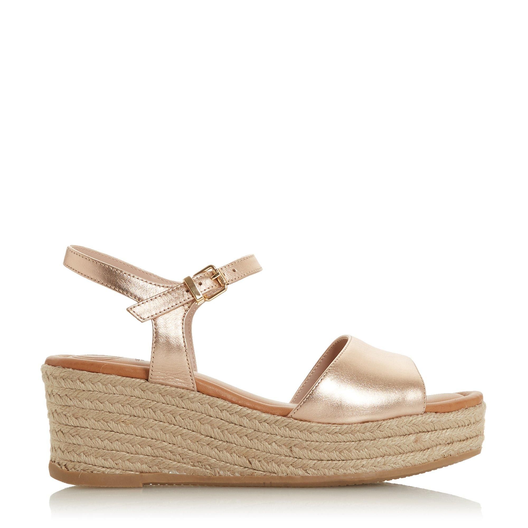 Exude effortless summer style with this sandal. Showcasing a two-part design with a front strap and open back. The buckle fastening and textured wedge heel complete the style.