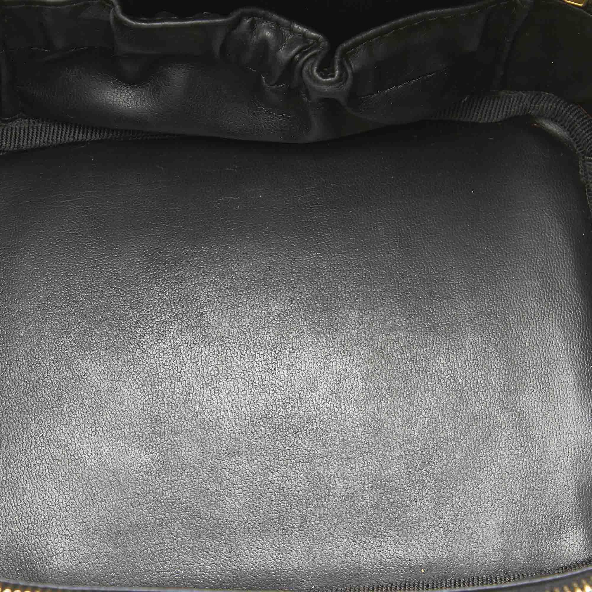 VINTAGE. RRP AS NEW. This vanity bag features a leather body with a quilted leather bottom, a flat top handle, a two way top zip around closure, and an interior slip pocket.
Dimensions:
Length 10.3cm
Width 19cm
Depth 13.7cm
Hand Drop 2cm
Shoulder Drop 2cm

Original Accessories: This item has no other original accessories.

Color: Black
Material: Leather x Lambskin Leather
Country of Origin: France
Boutique Reference: SSU97083K1342


Product Rating: GoodCondition