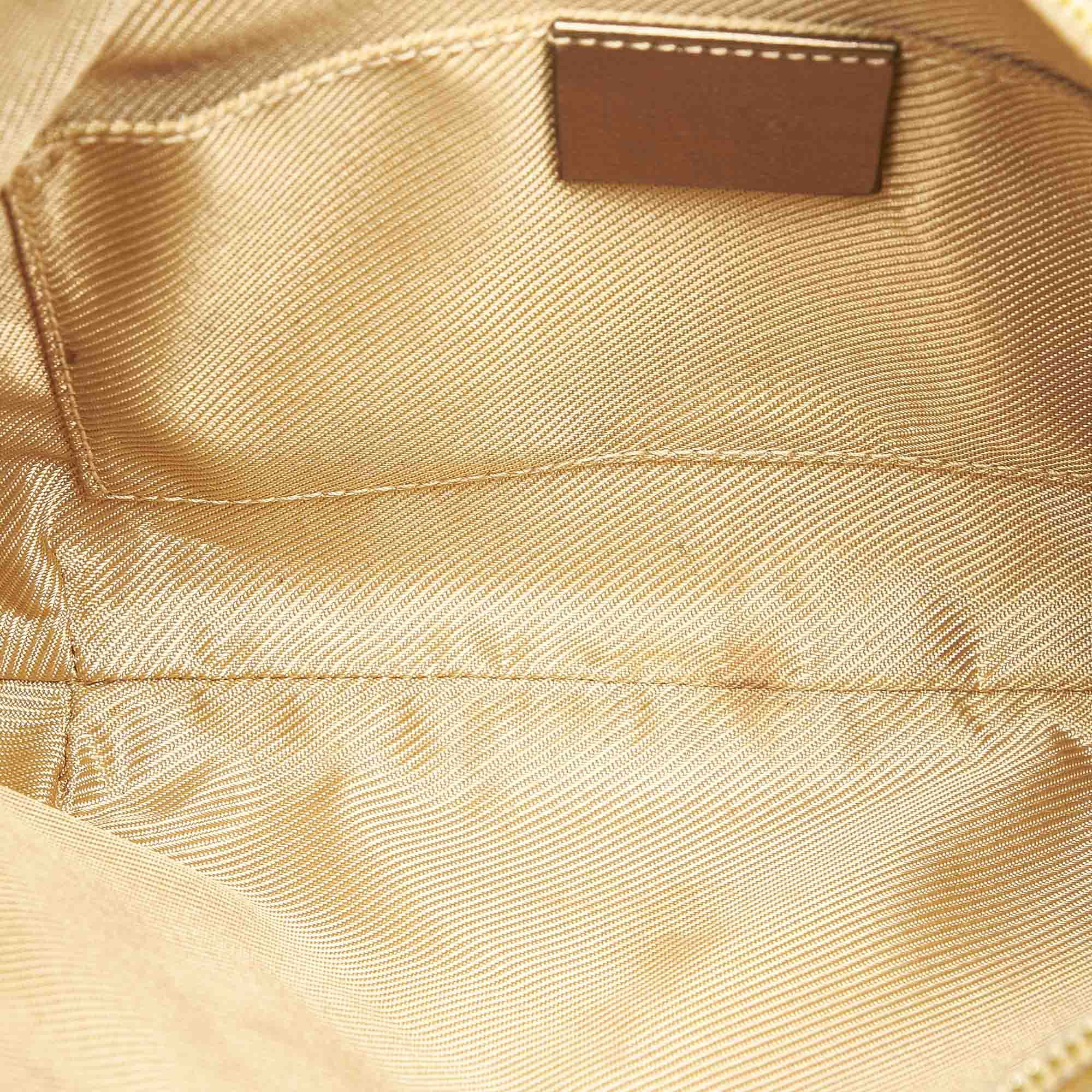 VINTAGE. RRP AS NEW. This shoulder bag features a canvas body, a flat leather strap, a top zip closure, and an interior zip pocket.
Dimensions:
Length 18.5cm
Width 26cm
Depth 1cm
Shoulder Drop 20cm

Original Accessories: This item has no other original accessories.

Color: Gold
Material: Fabric x Canvas x Leather x Calf
Country of Origin: Italy
Boutique Reference: SSU96257K1342


Product Rating: GoodCondition