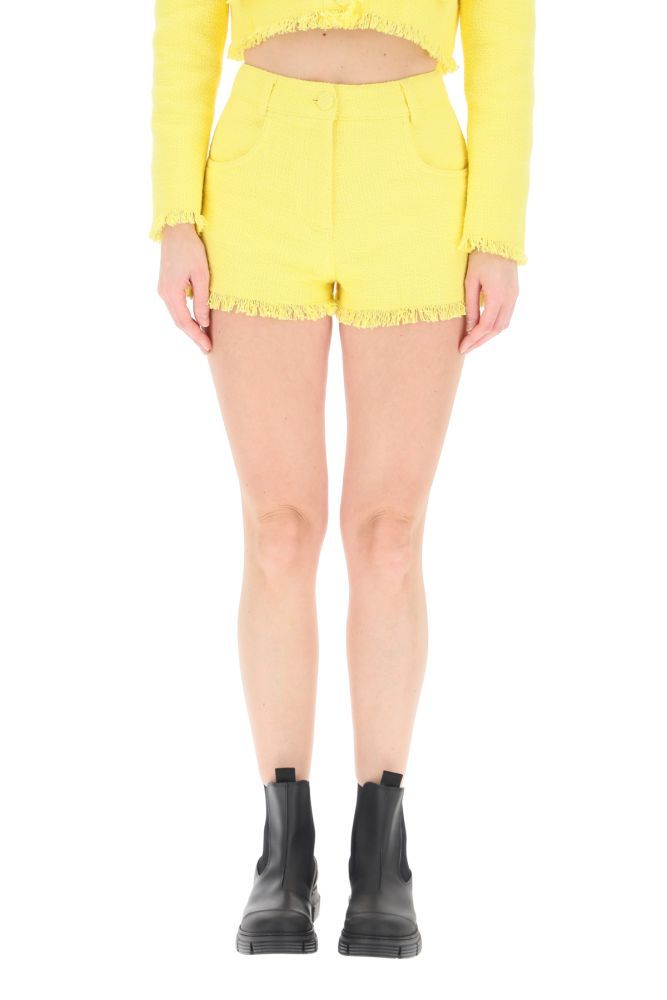 MSGM mid-rise shorts in cotton blend tweed, featuring short-fringed hem, front closure with zip fly and covered button, belt loops, side rounded pockets, rear patch pockets. Slim fit. The model is 177 cm tall and wears a size IT 38.