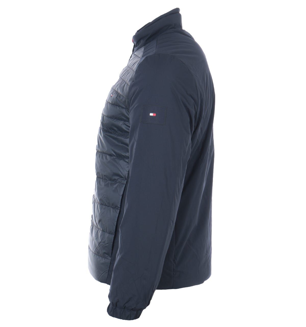 Designed with sustainability and supreme warmth in mind. This lightweight jacket from Tommy Hilfiger is the ideal piece to refresh your outerwear this season. Crafted from recycled polyester using advanced warming technology. Featuring a high neck with a full zip closure, zip chest pocket, snap button front pockets, elasticated cuffs and a quilted front. Finished with the iconic Tommy flag embroidered at the chest and signature stripe detail at the collar. Regular Fit, Recycled Polyester, Warming Technology, High Neck with Full Zip Closure, Quilted Padded Front, Zip Chest Pocket, Twin Front Snap Button Pockets, Elasticated Cuffs, Tommy Hilfiger Branding. Style & Fit:Regular Fit, Fits True to Size. Composition & Care:100% Recycled Polyester, Machine Wash.