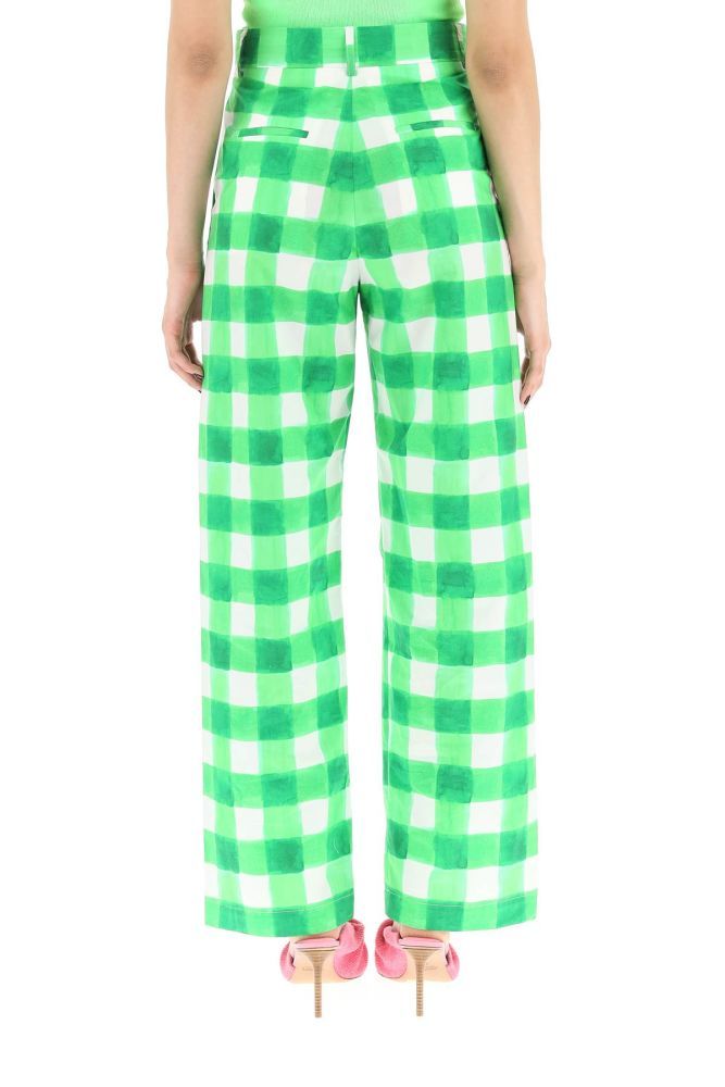 MSGM wide-leg trousers crafted in cotton poplin with all-over check print. They feature a concealed zip fastening with button on the front, high-waist with belt loops, two slash pockets and two rear welt pockets. Loose fit. The model is 177 cm tall and wears a size IT 38.
