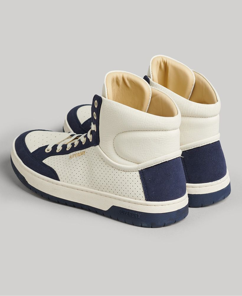 Deeply inspired by the classic styles of the basketball court, we've used contemporary materials to reinvent an iconic look. These high topped trainers are a secure fit that will let your feet breathe for maximum comfort. Not only do they offer a luxuriously sporty chic, but their sustainable sourcing ensures that every step you take is on a healthier planet.Padded ankleMulti-hole lacingVentilated toe capDebossed foil logoEmbossed side branding'Vegan' embossed soleOur trainers are registered with The Vegan Society and contain no animal products.