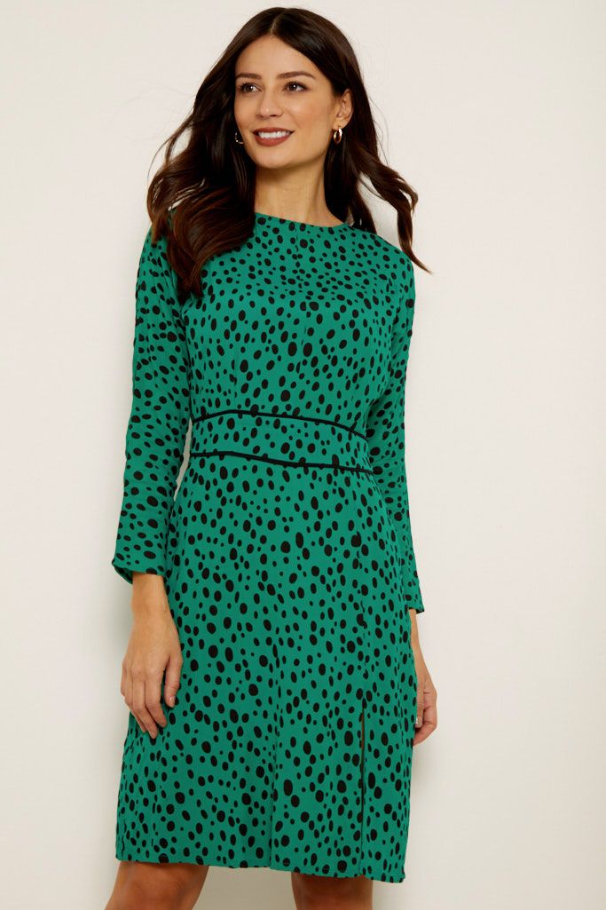 REASONS TO BUY: 

Spots are always in style 
A shade to stand out in 
Fluid fabric flatteringly drapes over your figure 
Waist panels to accentuate your middle 
Front splits for added sexiness 
Wear it with courts for work, ankle boots at the weekend  